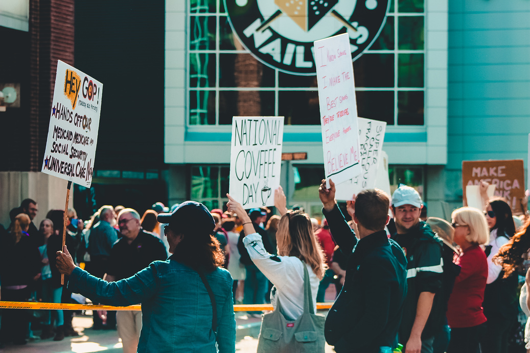 Crowd of People Holding Signages